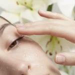Anti-aging serum for sensitive skin: close-up of a face with gentle application.