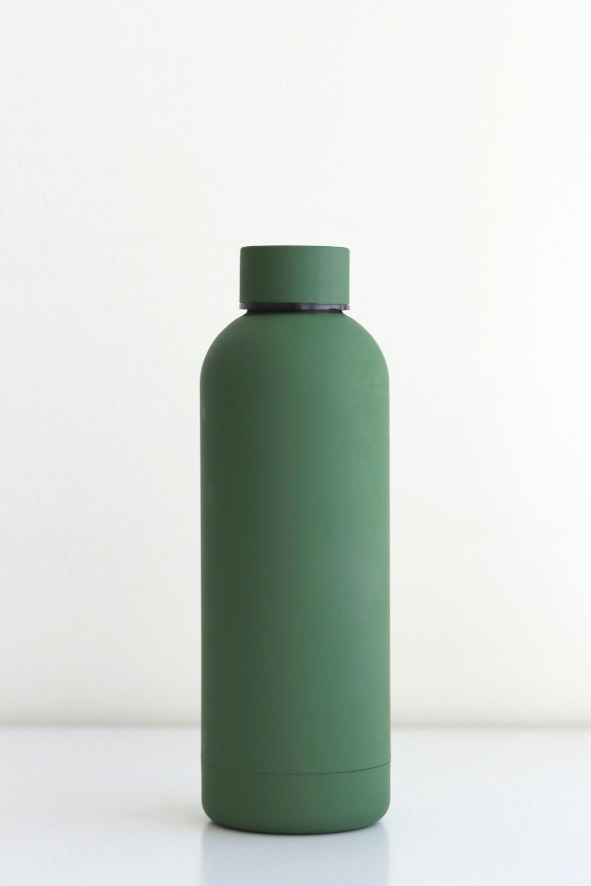 Sleek stainless water vessel representing pure conscious hydration