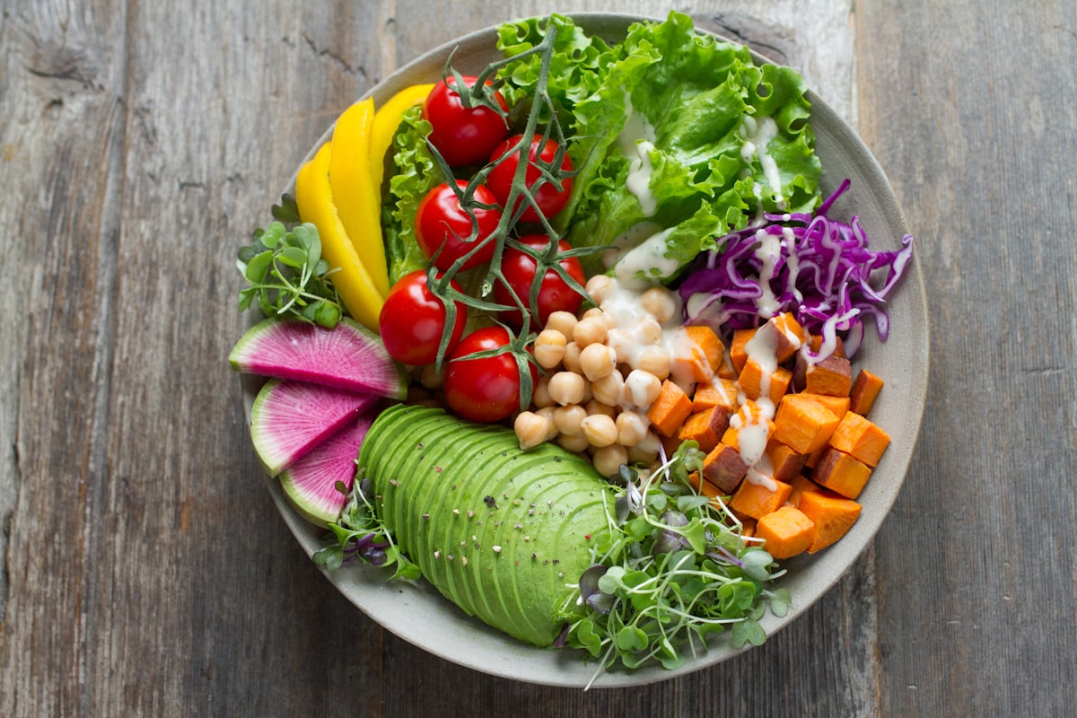 Fresh organic vibrant green smoothie bowl packed with dark leafy crucifers