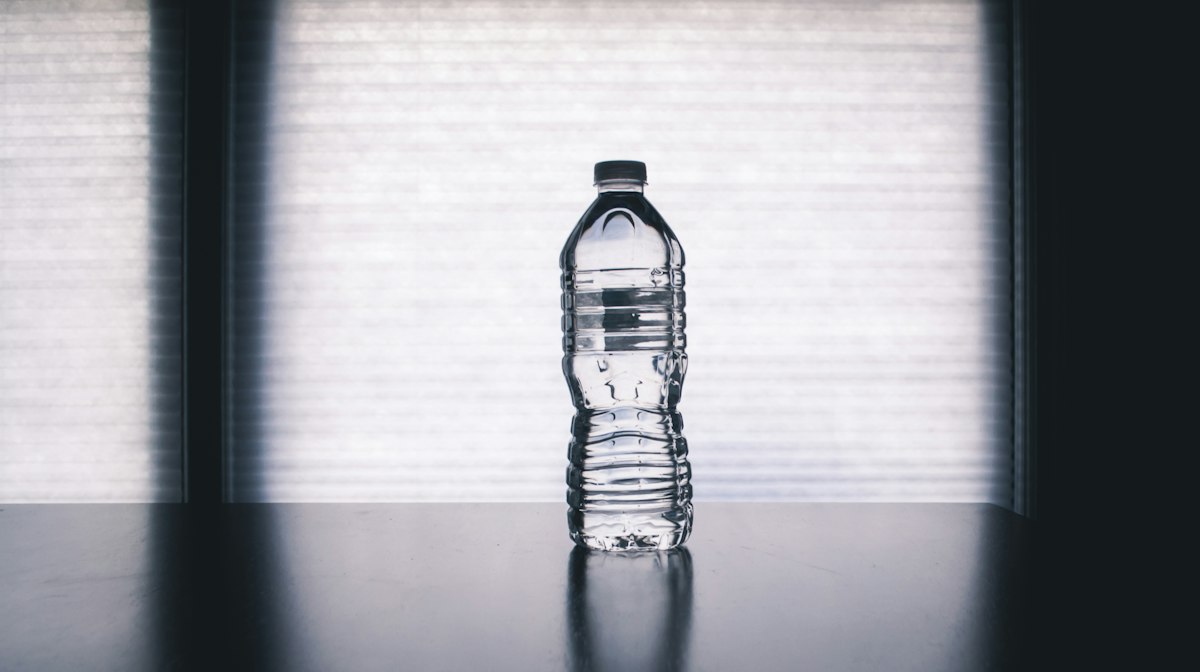 Electrolyte-rich citrus infused fresh mineral water in glass carafes