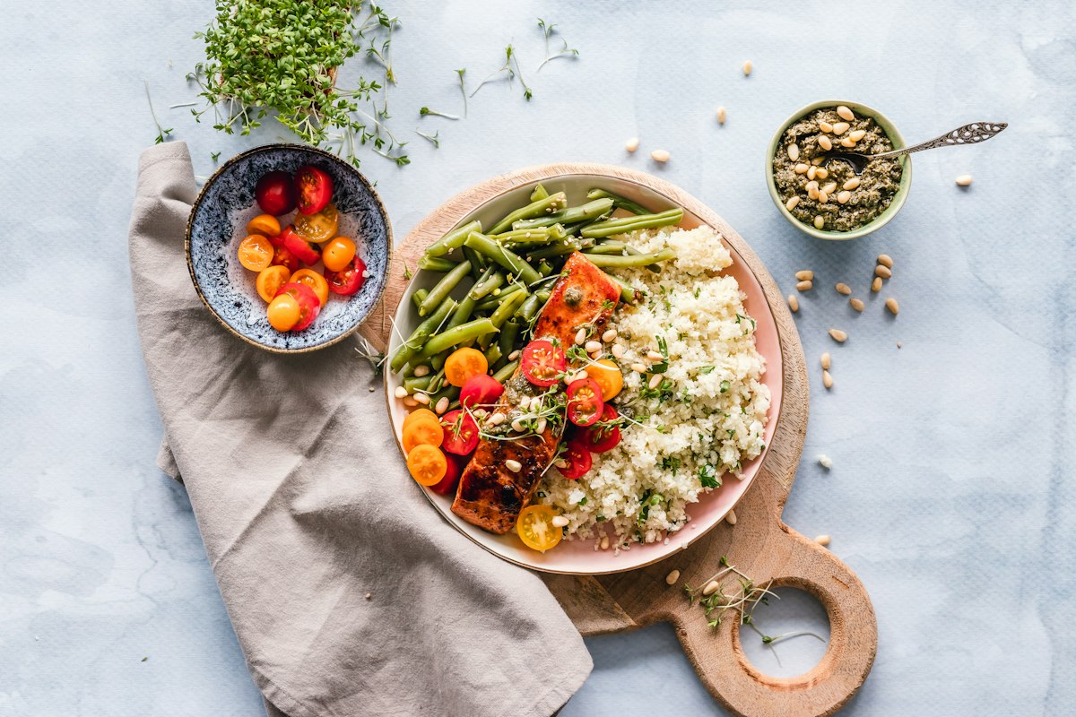 Systematic meal prep glass containers organized with whole food ingredients
